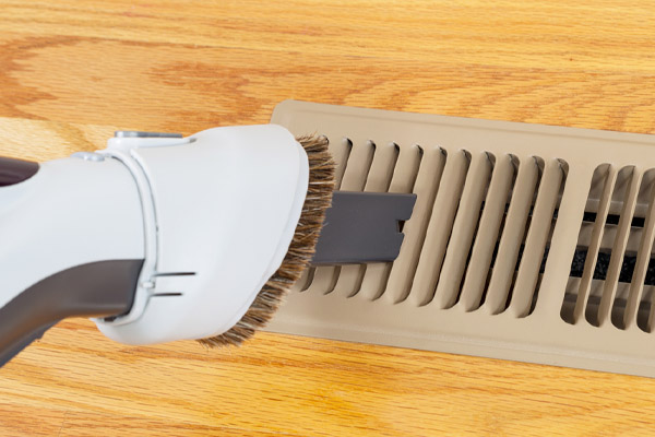 cleaning heater vent with vacuum