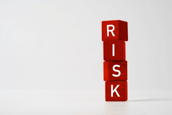 risk spelled using red letter dice depicting closing HVAC vent