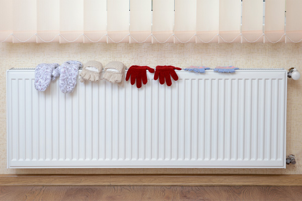 mittens drying on a warm radiator