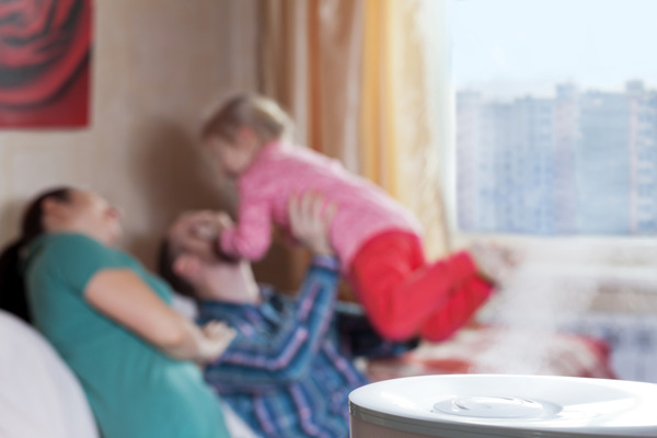 image of a family in a room with a humidifier