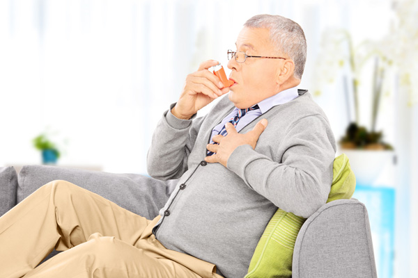 image of a man with respiratory issues and inhaler