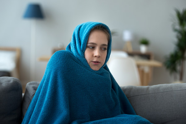 young girl who feels a cold spot in her house