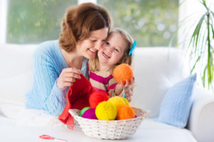 image of a family enjoying home heating while knitting