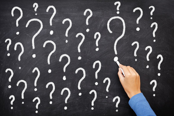 question marks written on chalkboard depicting FAQs about heating oil delivery smells