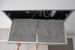 image of an oil-fired furnace filter replacement