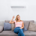 homeowner operating ductless air conditioner