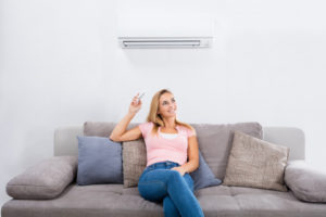 homeowner operating ductless air conditioner