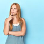 image of a thinking woman depicting what to check when air conditioner won't turn on