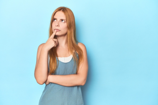 image of a thinking woman depicting what to check when air conditioner won't turn on