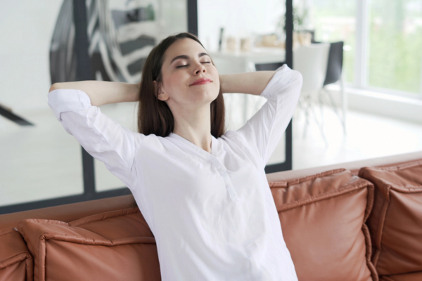 woman staying cool depicting AC working efficiently