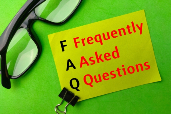 frequently asked questions written on a sticky note depicting FAQs about What To Do When Your AC Unit Freezes Up