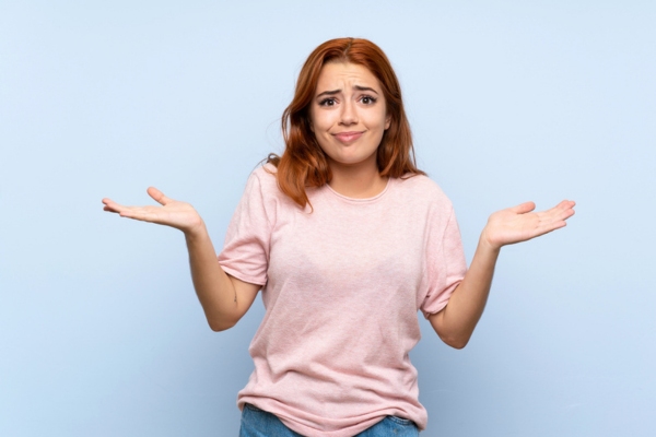 woman shrugging depicting What to Do Immediately When Your Cooling System Freezes