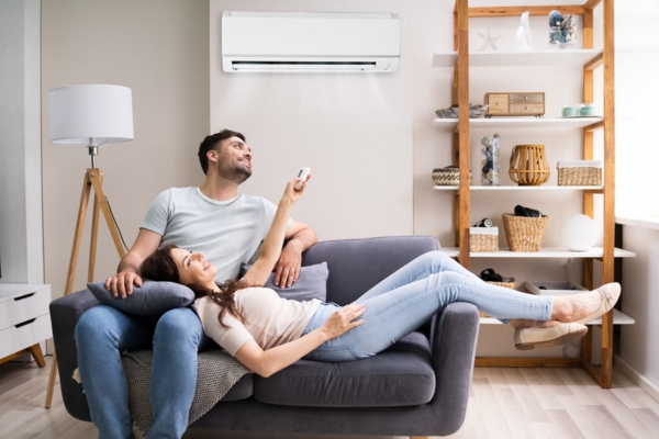 couple turning on ductless mini split