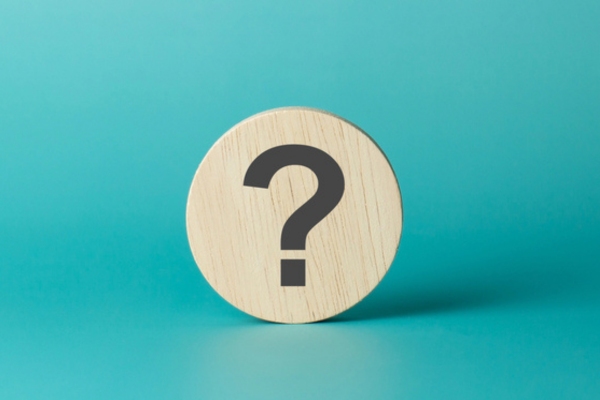 question mark on a wooden circular chip depicting FAQs about How To Size a Standby Generator