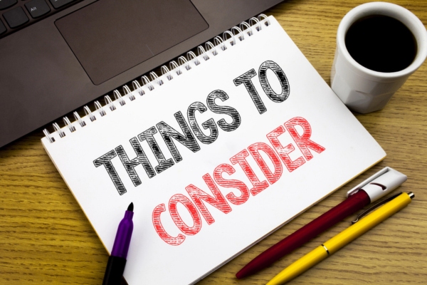Things To Consider written on a notebook depicting Considerations When Buying an Oil Tank