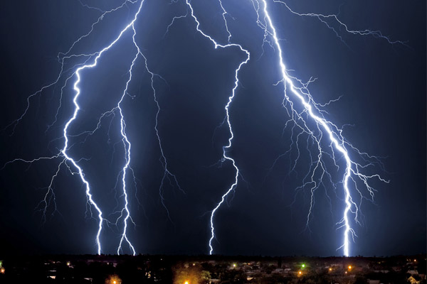 house with power at night during a power outage and backup generator