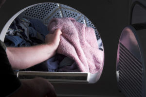 laundry room with an electric dryer