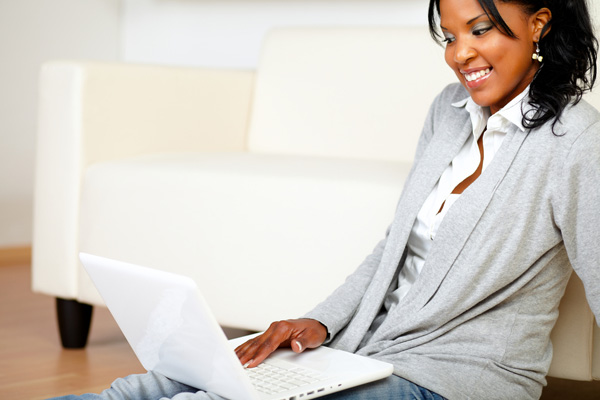 woman on computer researching carpet vocs