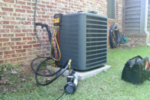 image of an air conditioner compressor repair