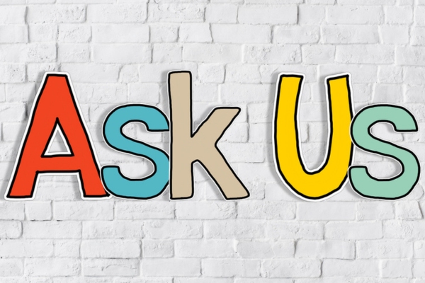 Ask Us spelled using cutout letters depicting FAQs about AC Compressor Working But Not Cooling