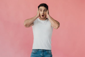 image of a homeowner covering ears due to hvac ductwork making noise