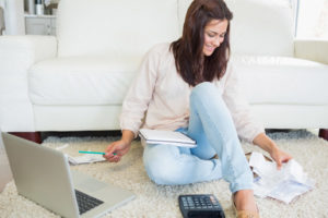 image of a homeowner paying low energy costs due to furnace's high efficiency afue rating