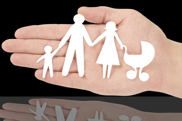 image of a paper cut family depicting heating fuel safety