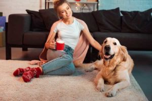 image of homeowner and dog depicting air quality in winter