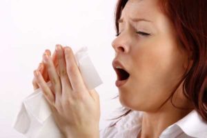 image of homeowner with allerdies due to dry indoor air