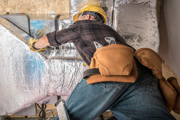 image of an hvac contractor with hvac ducts