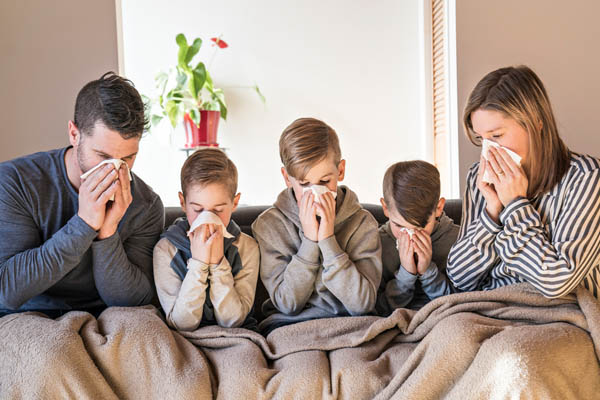 sick family in bed due to indoor air pollution