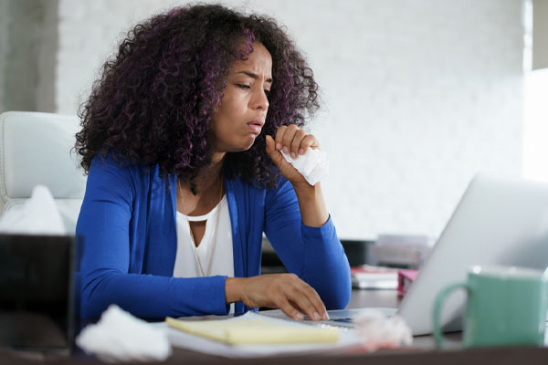 image of a sick woman at home depicting poor iaq