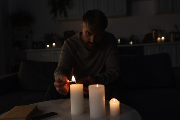 image of a homeowner during power outage because standby generator failed to start