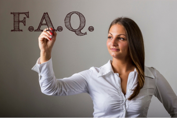 woman writing FAQ on a virtual board depicting questions about Heat Pump Freezing Up in Summer
