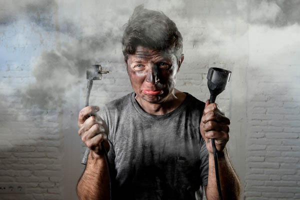 image of homeowner conducting diy air conditioner electrical repairs