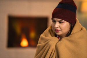 homeowner feeling chilly due to heating problem at home