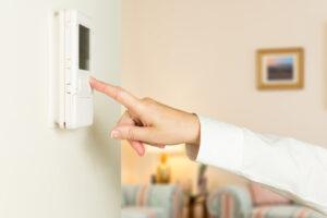adjusting thermostat of hvac system