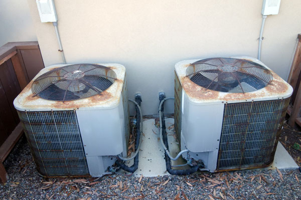rusty old air conditioner condenser unit