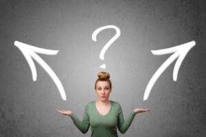 woman making a decision depicting ductless vs window AC