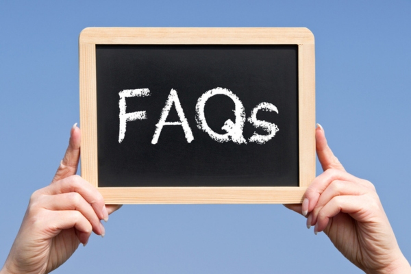 FAQs written on mini chalkboard depicting questions about Whole-House Generator Maintenance