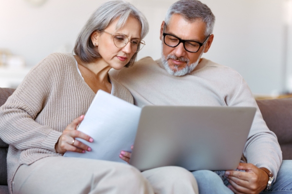 couple reading backup generator manual