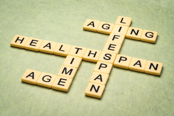 Aging, time, lifespan and healthspan crossword in letter tiles depicting boiler