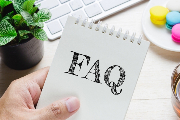 FAQ written on a notepad depicting questions about how long does a boiler last
