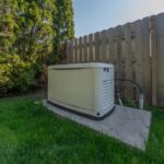 standby generator installed by the home fence
