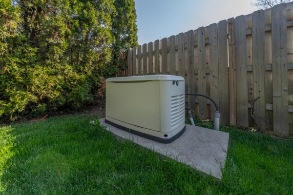 standby generator installed by the home fence