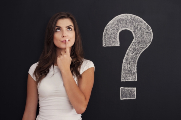 image of thinking woman beside a question mark doodle depicting How Often Should You Replace Your HVAC Air Filter