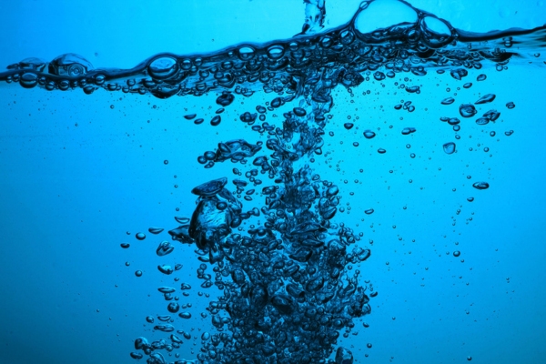 splash of water with bubbles depicting water in oil tank