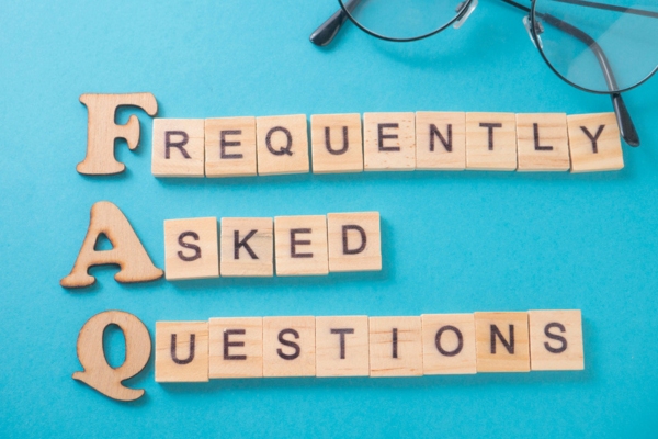 Frequently Asked Questions spelled using wooden letters and cubes depicting Boiler Efficiency FAQs