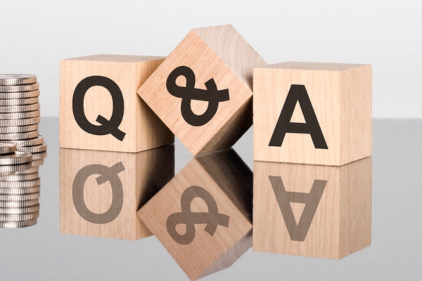 Q&A on a wooden cube depicting Save Heating Oil With Insulation FAQs