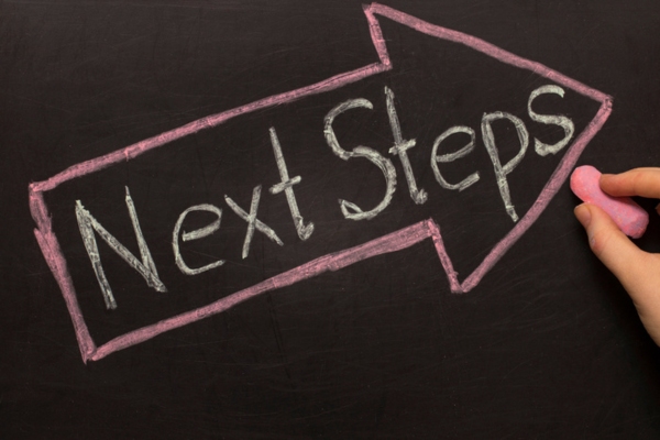 Next Steps written on a chalkboard depicting Steps to Take When Your Generator Is Buried by Snow